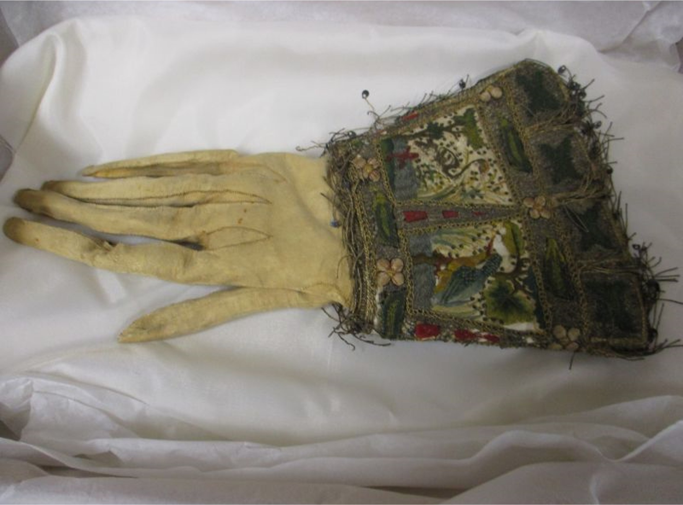 17th Century glove with Kingfisher embroidery