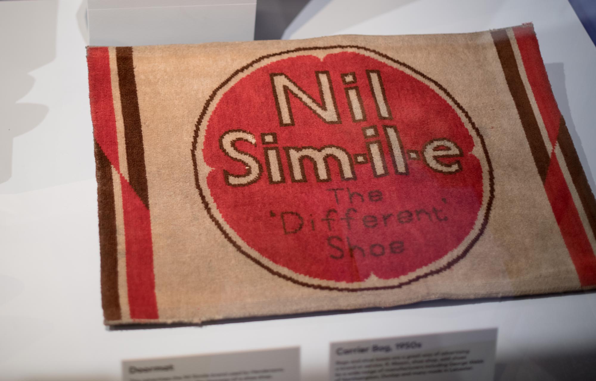 Nil Simile doormat advert. The Nil Simile brand was bought by Equity in 2000